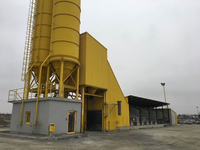A yellow and grey building

Description automatically generated