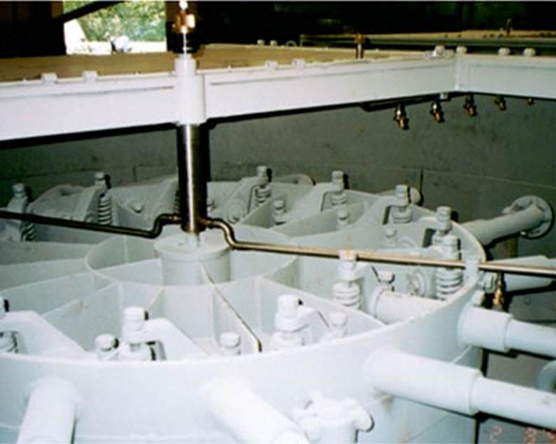 A large white machine with pipes

Description automatically generated